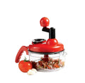 Red manual food chopper with ingredients on a white background